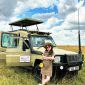 Tourist enjoying game view at masai mara safari