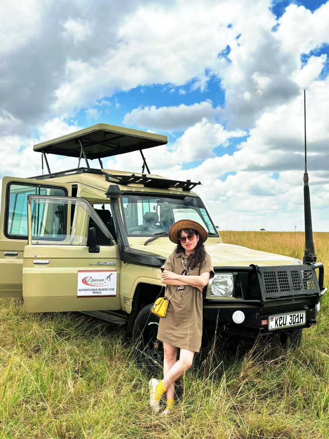 Tourist enjoying game view at masai mara safari