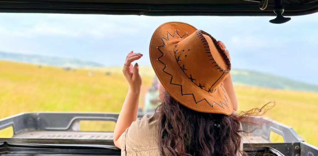 A tourist on game drive in Amboseli Kenya jpg