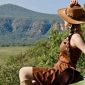 A tourist on top of a safari vehicle in Naivasha Kenya jpg