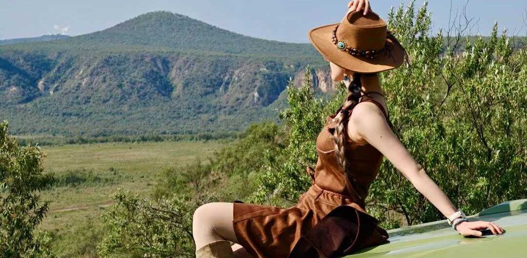 A tourist on top of a safari vehicle in Naivasha Kenya jpg